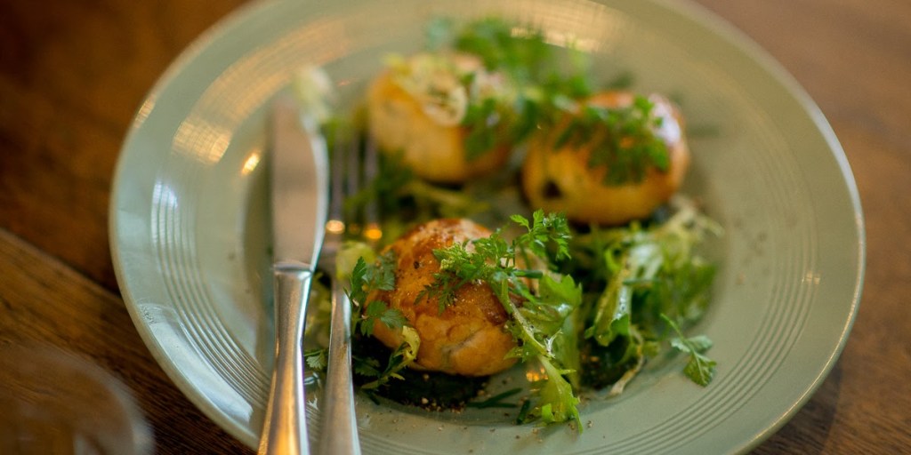 Escargot in puff pastry with garlic butter and parsley puree. Photo: Nat Rogers/InDaily