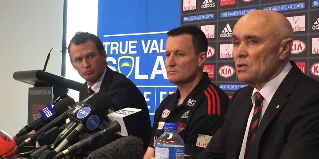 Essendon CEO Xavier Campbell (left) and chairman Paul Little (right) announce John Worsfold as the club's new coach for 2016-2018. AAP Image