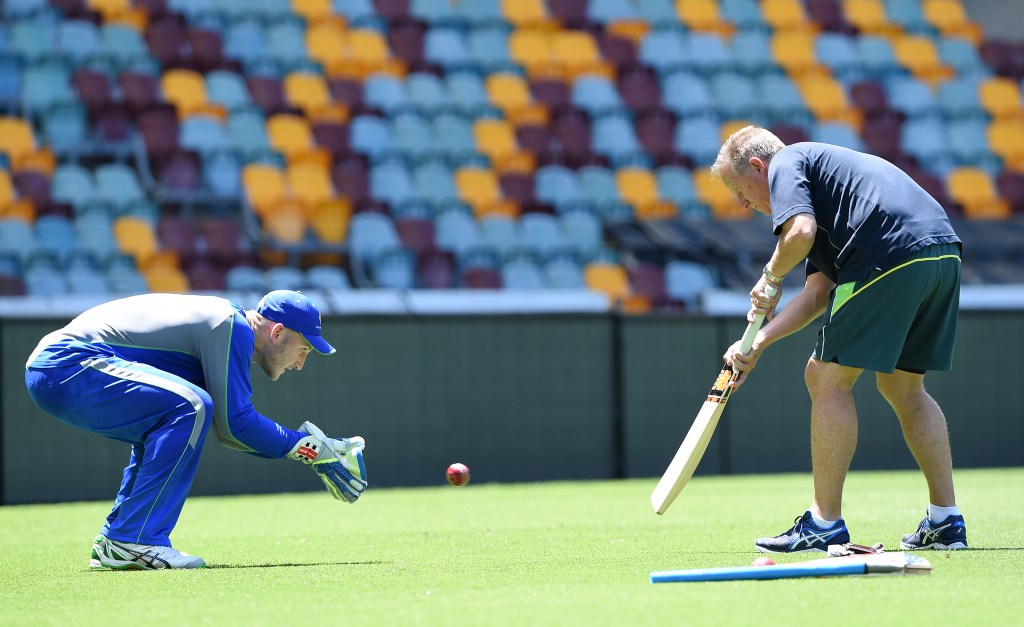 Australian wicket keeper Peter Nevill practices with former Australian keeper Ian Healy at the Gabba yesterday. 