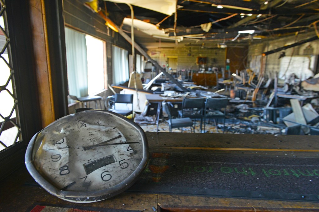 A clock frozen in time in the local bowls club destroyed by fire in the mid-north town of Wasleys in South Australia. AAP Image/Brenton Edwards
