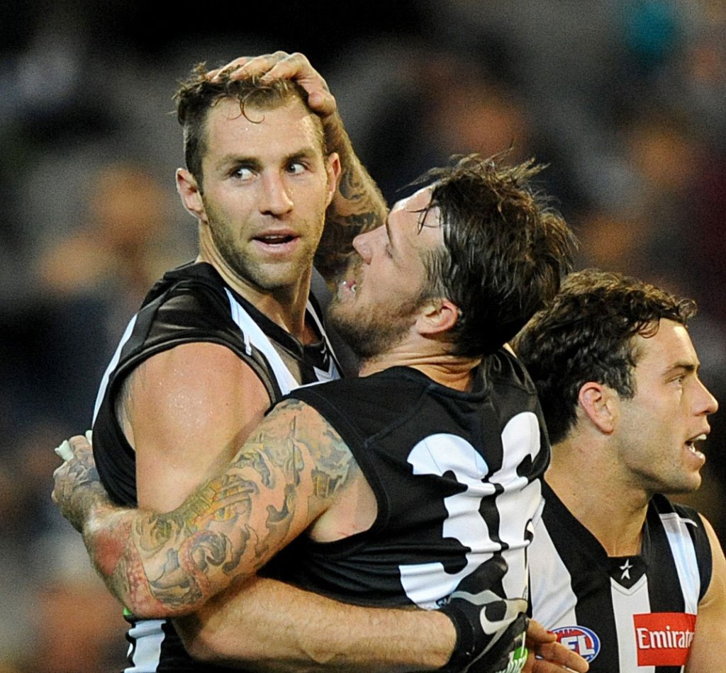 Travis Cloke (left) celebrates with Dane Swan after a Collingwood victory. AAP image/Joe Castro