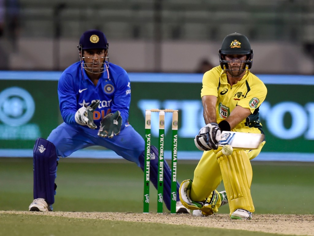 Glenn Maxwell plays a reverse sweep infront of MS Dhoni during his match-saving ODI innings. Photo: Mal Fairclough, AAP.