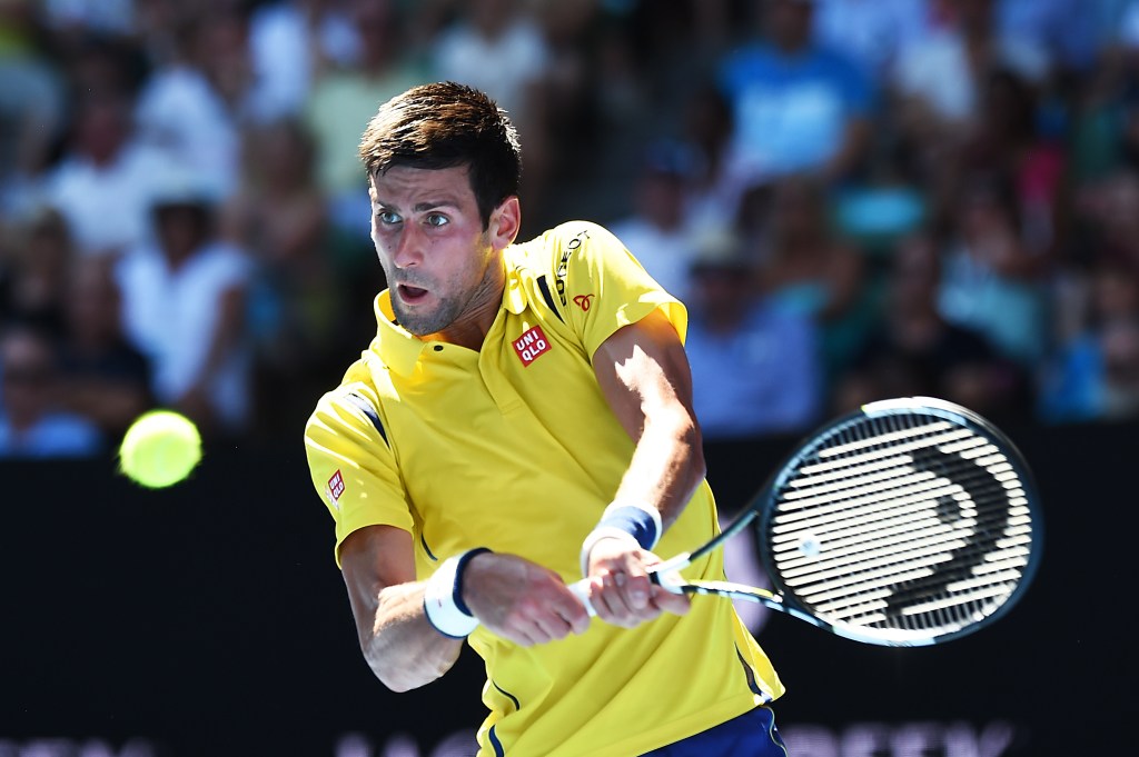 Novak Djokovic playing South Korea's Hyeon Chung at the Australian Open yesterday. Photo: Lukas Coch, AAP.