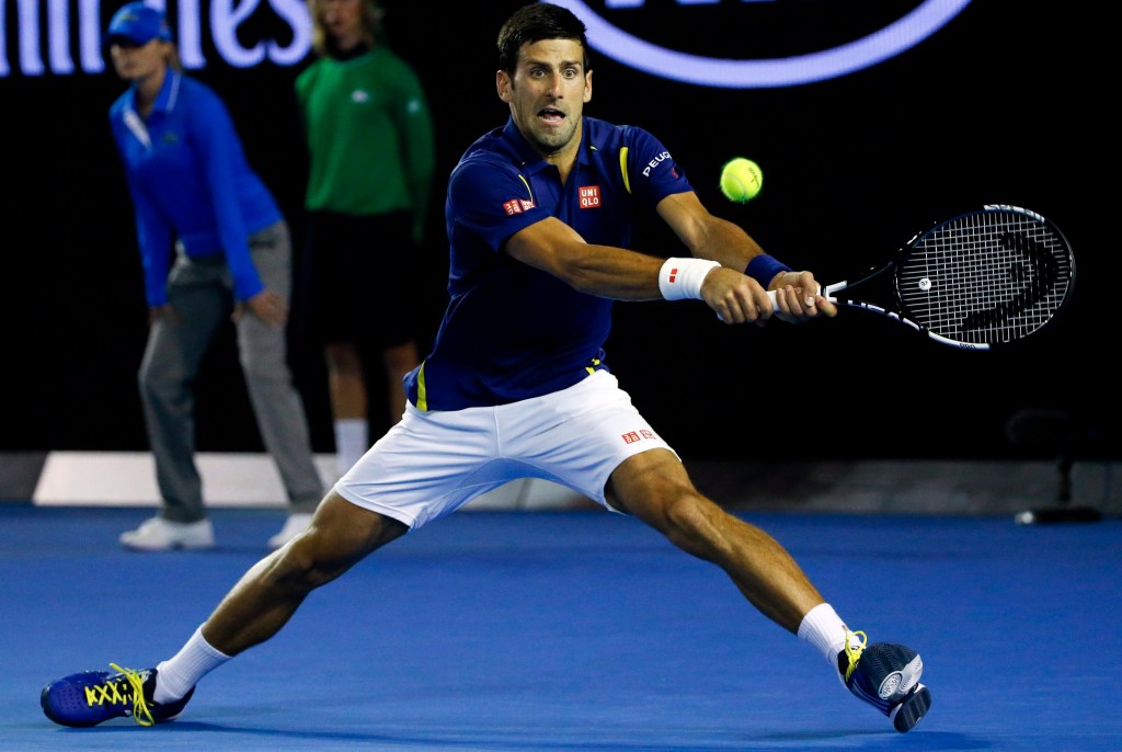 Novak Djokovic returns the ball to Frenchman Quentin Halys during their second round match. Photo: LYNN BO BO, EPA.