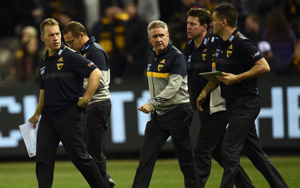 Alastair Clarkson with his coaching assistants during a match against Carlton last year. Photo: Julian Smith, AAP.