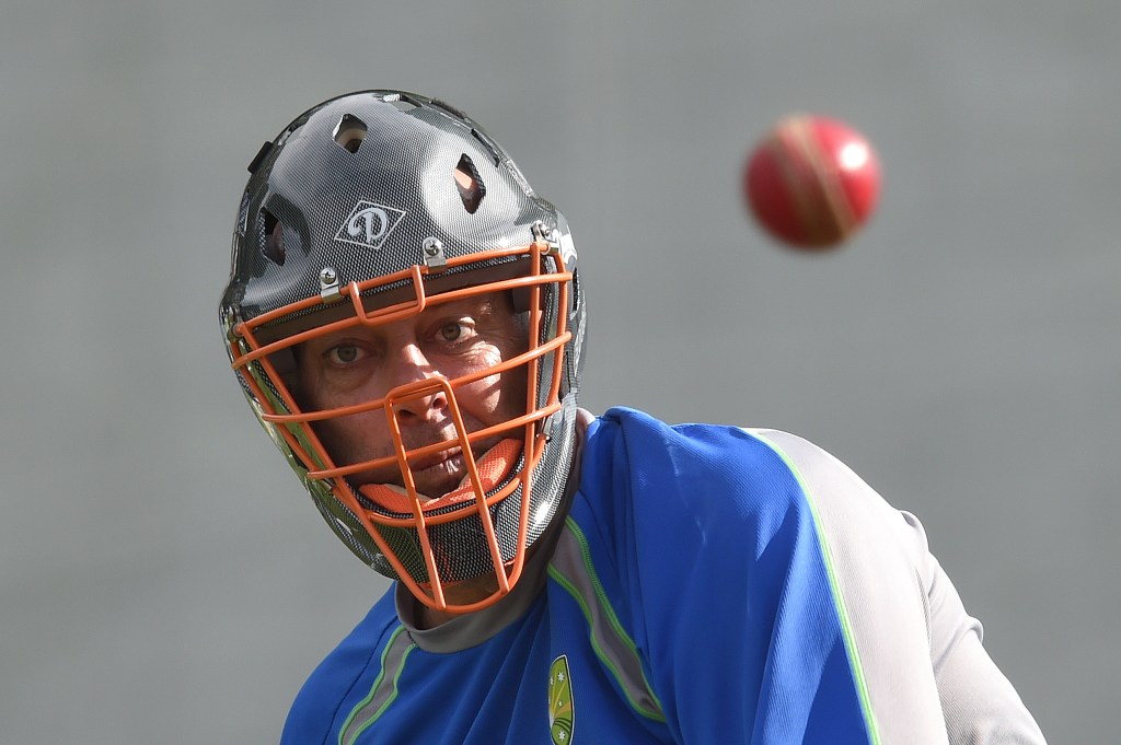 Darren Lehmann wears a safety helmet in the nets during an Australian cricket team training session at Hagley Oval in Christchurch. Photo: Dave Hunt, AAP.