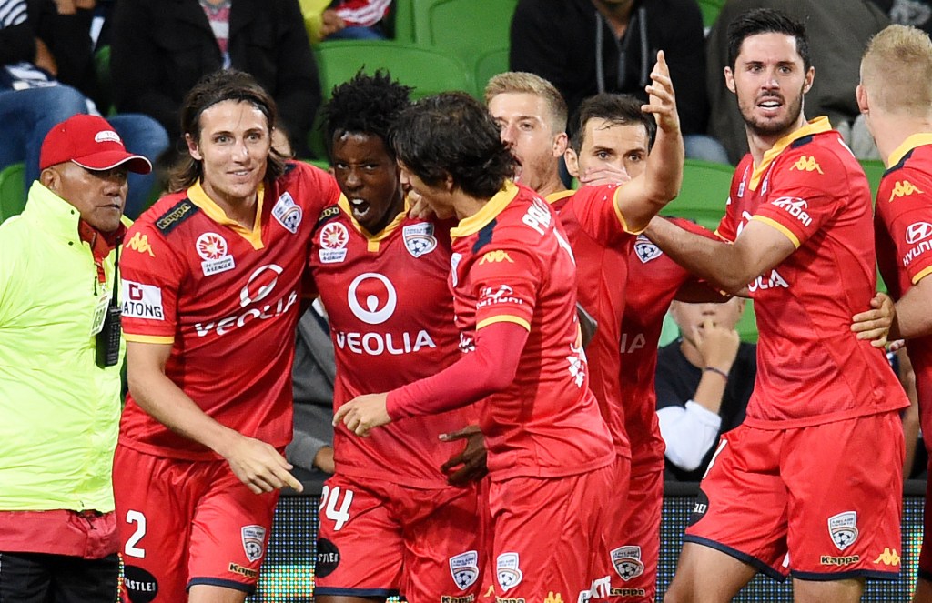 Bruce Kamau celebrates the winning goal that put Victory to the sword. Photo: Tracey Nearmy, AAP.
