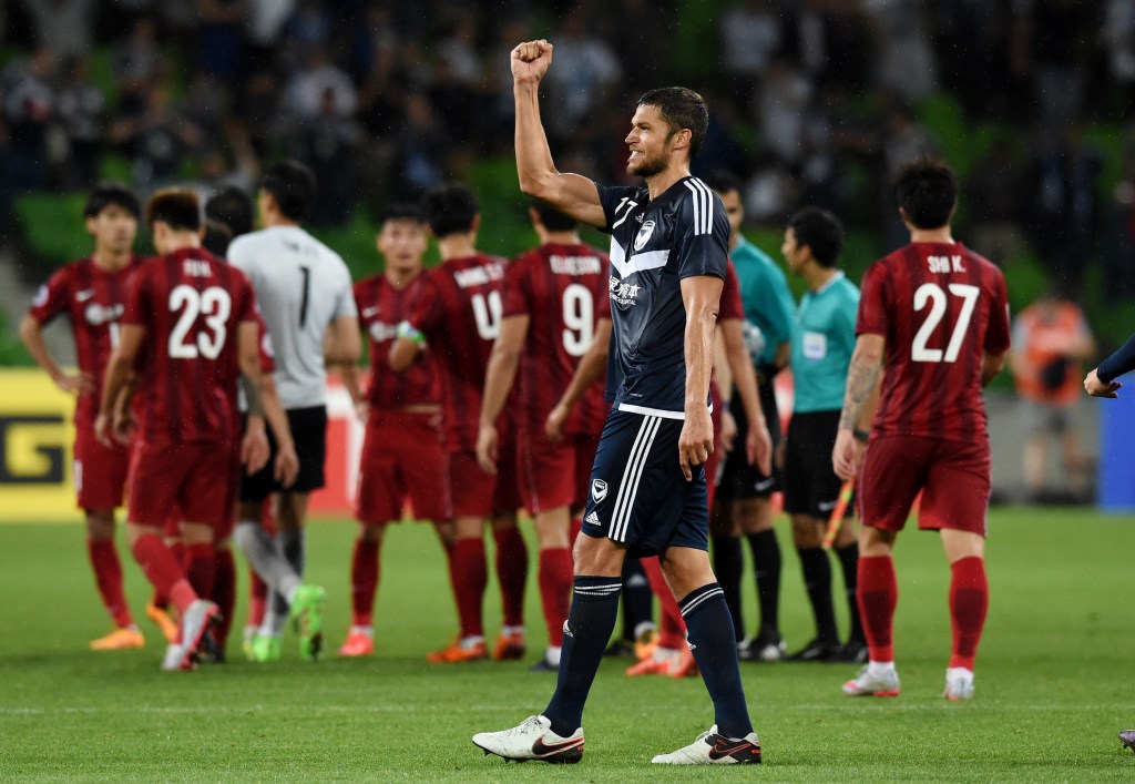 Matthieu Delpierre of the Victory celebrates their win against China's Shanghai SIPG at AAMI Park. Photo: Tracey Nearmy, AAP.
