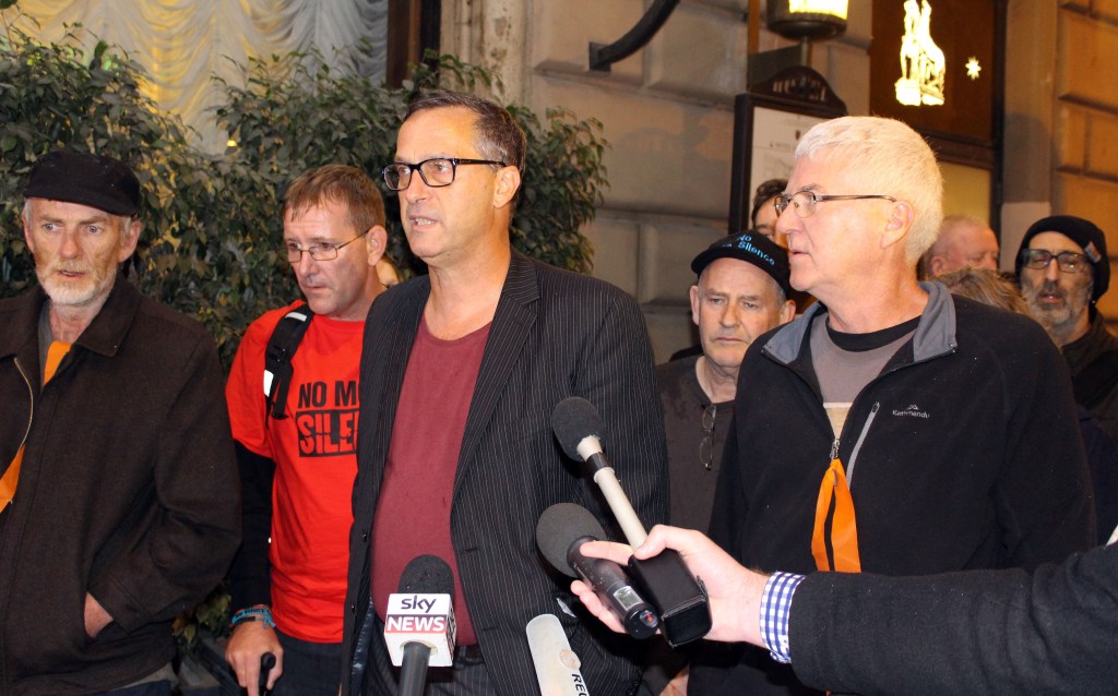 Abuse survivors led by David Ridsdale (centre) arrive at the Quirinale Hotel to watch Cardinal George Pell give evidence to the child abuse royal commission. Photo: AAP/Lloyd Jones