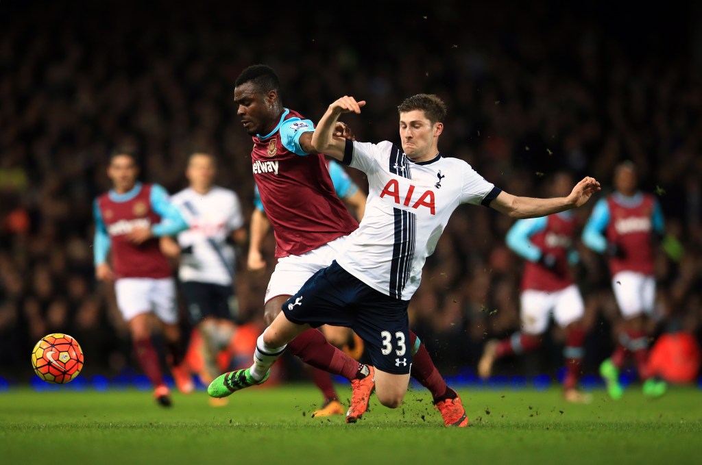 West Ham United's Emmanuel Emenike (left) and Tottenham Hotspur's Ben Davies battle for the ball. Photo: John Walton, PA Wire. 