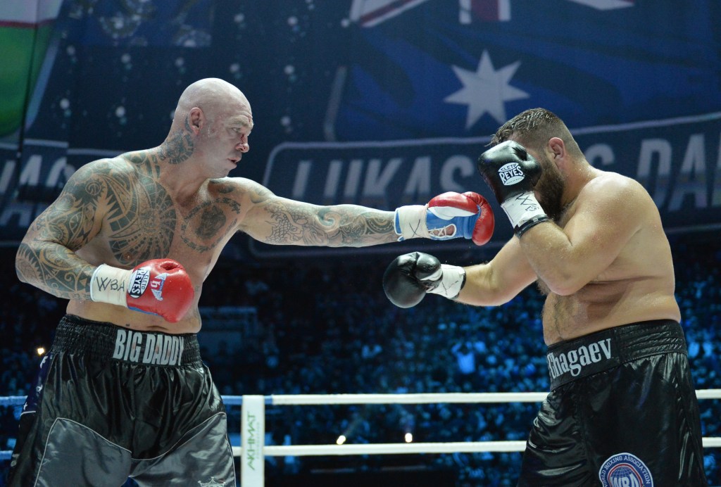 2802615 03/06/2016 Australia's Lucas Browne, left, and Uzbekistan's Ruslan Chagaev in the match for the WBA world heavyweight title. Said Tsarnaev/Sputnik via AP