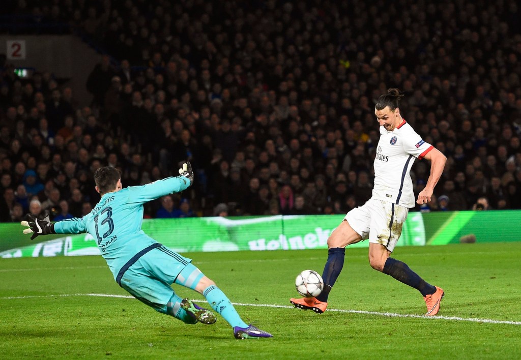 Zlatan Ibrahimovic puts the ball past goalkeeper Thibaut Courtois to put Paris Saint-Germain's 2-1 up against Chelsea. Photo: FACUNDO ARRIZABALAGA, EPA.