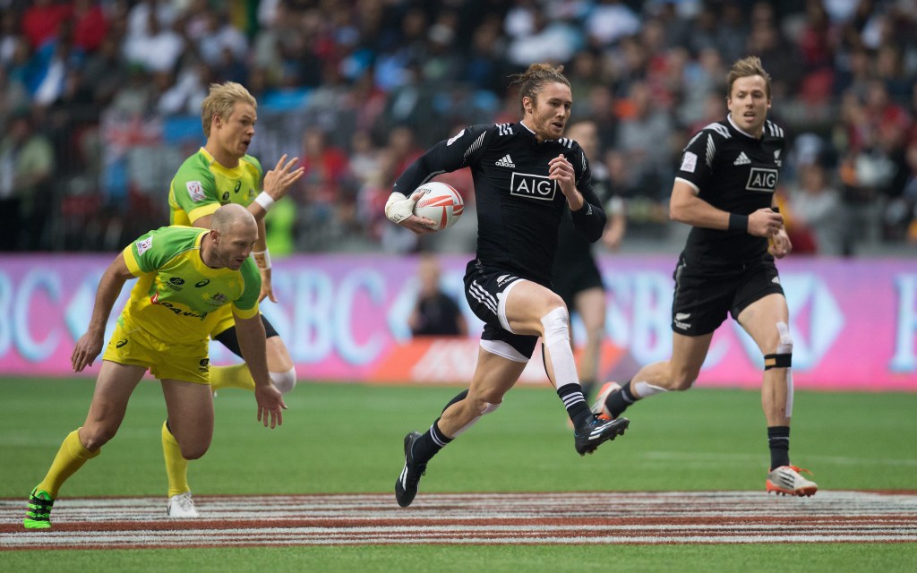 New Zealand's Gillies Kaka, flanked by teammate Tim Mikkelson, runs the ball in for a try while being chased by Australia's James Stannard (left) and Tom Kingston. Photo: Darryl Dyck, The Canadian Press/AP.