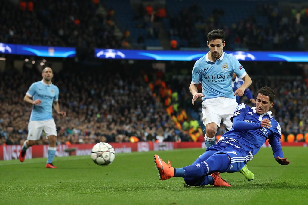Dynamo Kiev's Oleksandr Yakovenko (right) and Manchester City's Jesus Navas battle for the ball during the UEFA Champions League match at Etihad Stadium, Manchester. Photo: Martin Rickett, PA Wire.