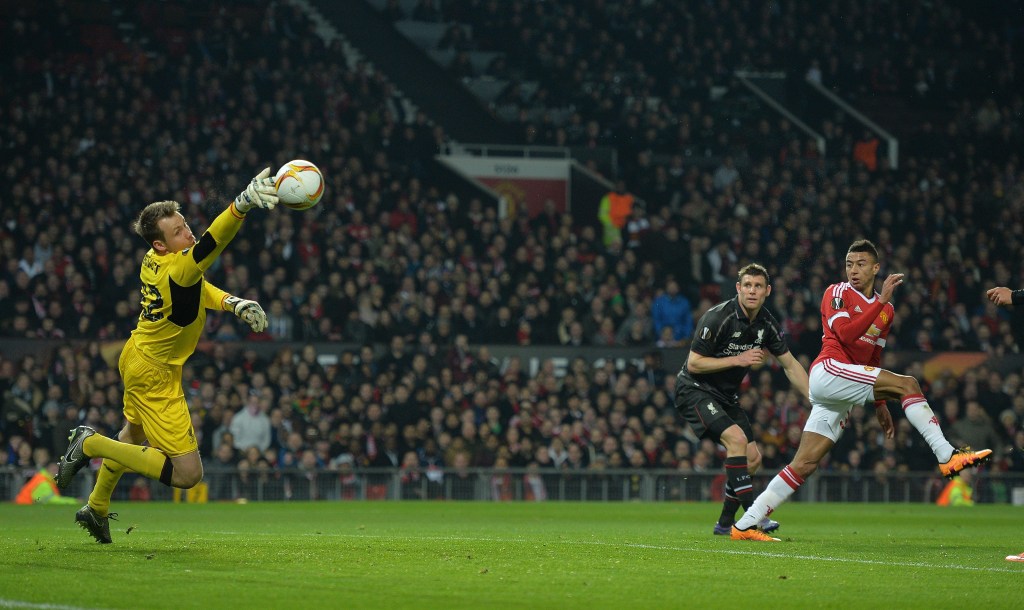 Liverpool's Simon Mignolet makes a save from Manchester United's Jesse Lingard. Photo: PETER POWELL, EPA.