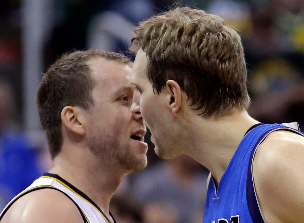 Happy Valley-born Utah Jazz forward Joe Ingles, left, and Dallas Mavericks forward Dirk Nowitzki exchange words during the second quarter in Salt Lake City. Photo: Rick Bowmer, AP.