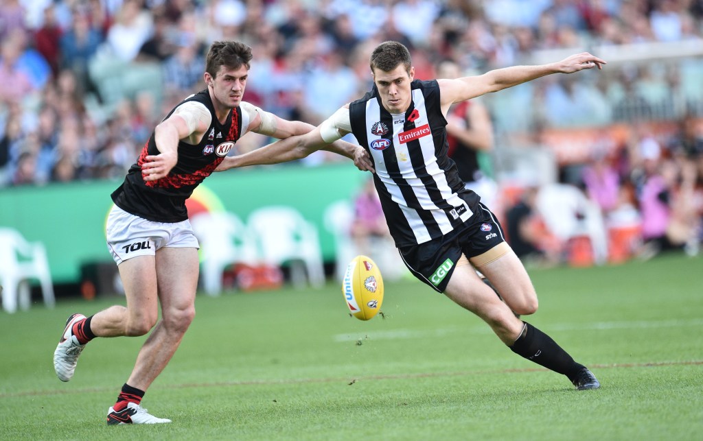 US import Mason Cox flies in as the Magpies dominate Essendon. Photo: Julian Smith, AAP.
