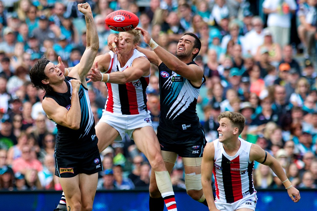 Long-serving defender Alipate Carlile, right, has called time at the Power. Photo: Michael Errey / InDaily