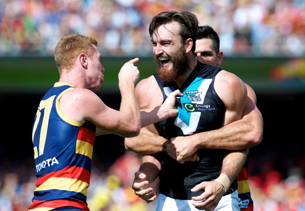 Showdown medallist Tom Lynch unsuccessfully tries to explain goalkicking to Gold Coast import Charlie Dixon. Photo: Michael Errey, InDaily.