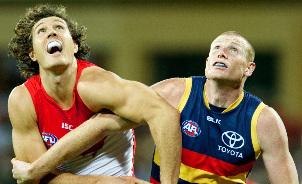 Kurt Tippett and Sam Jacobs wrestle in the ruck contest. Photo: Michael Errey, InDaily.