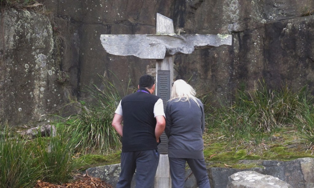 Tourists read names on a memorial at the site of the Port Arthur massacre. Photo: AP