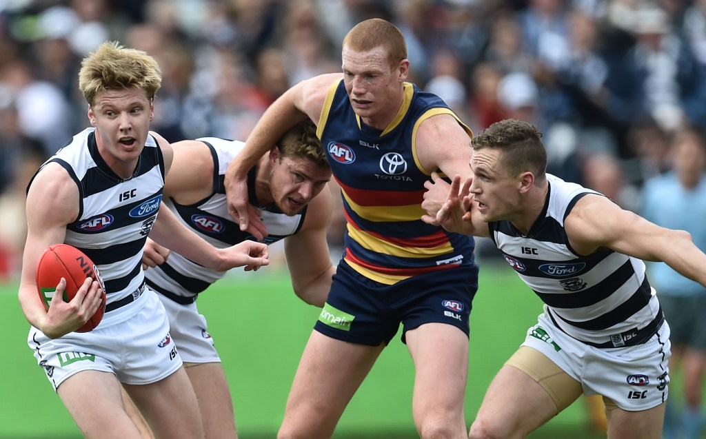 George Horlin-Smith (left) gets attention from Crows ruckman Sam Jacobs last year. Photo: Julian Smith, AAP.