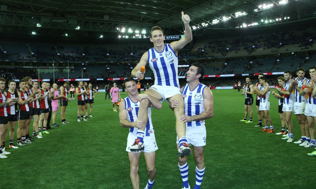 Drew Petrie is chaired off the field after his 300th game against St Kilda, but the win wasn't without controversy. Photo: David Crosling, AAP.