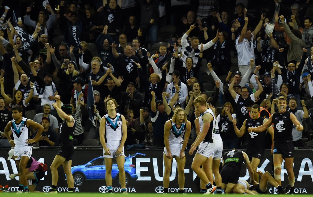 Carlton celebrate as the siren sounds. Photo: Tracey Nearmy, AAP.