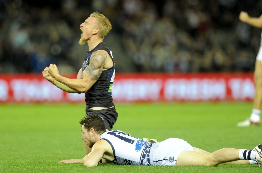 Dennis Armfield of the Blues celebrates after kicking a goal. Photo: Joe Castro, AAP.