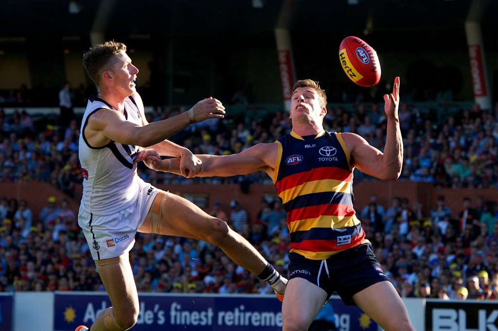 Josh Jenkins takes a one-handed grab against Fremantle. His future is up in the air, with reports of a significant deal on the table from Brisbane. Photo: Michael Errey, InDaily.