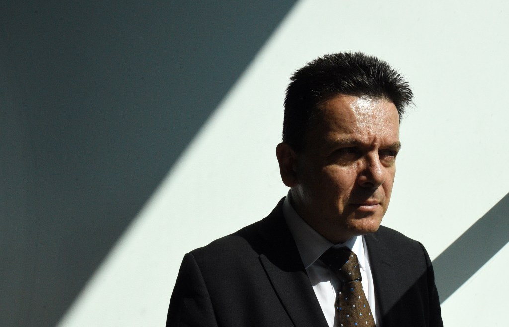 "When he comes on the telly I turn off": The priest named under privilege by Nick Xenophon says he feels angry when he sees the Senator's election posters. Photo: Mick Tsikas, AAP
