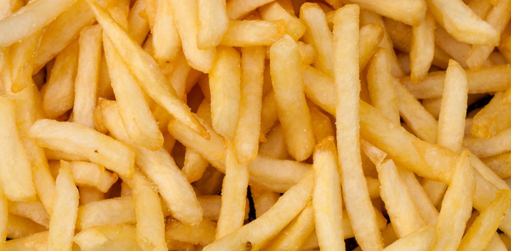 A bucket of chips contains around 275mg of sodium, which accounts for 16 per cent of an adult’s daily limit. Photo: Darkkong/Shutterstock