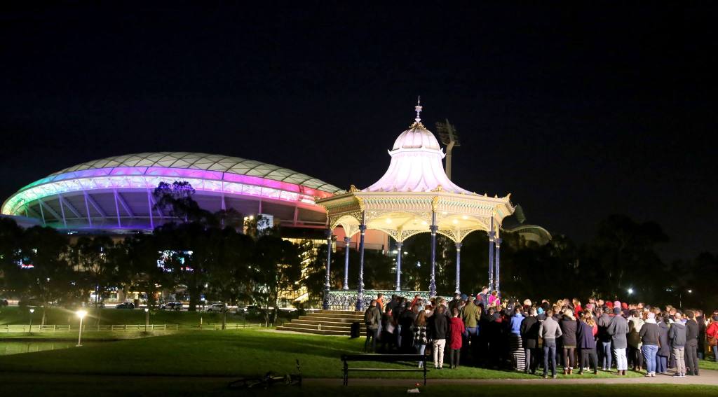 Adelaide Oval is lit up in rainbow colours last night during a vigil at Elder Park. Photo: Facebook.