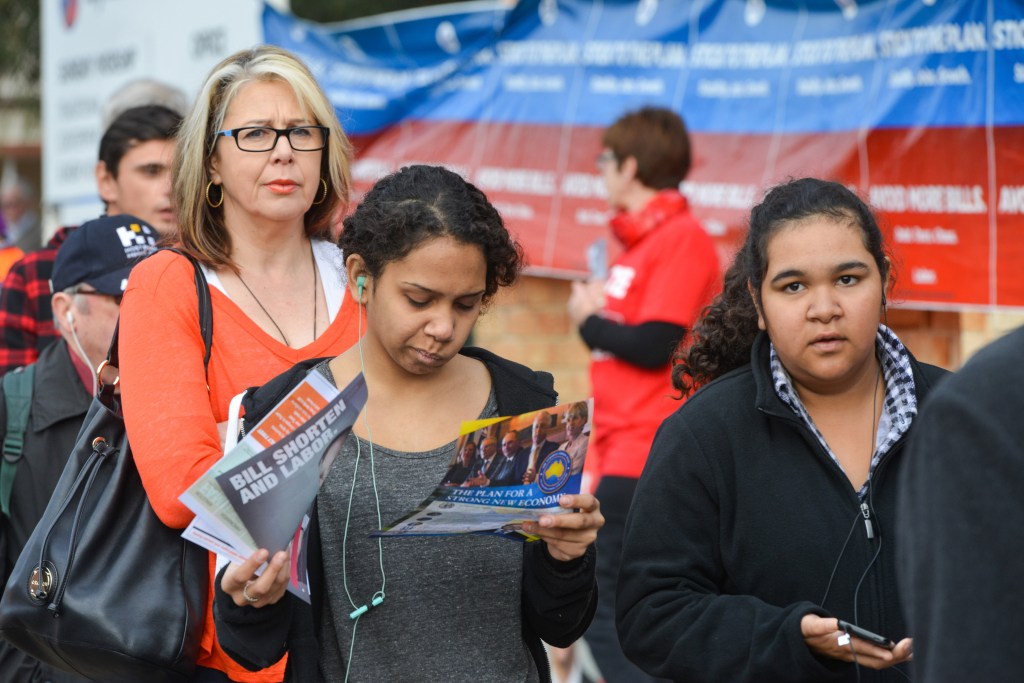 UNCERTAIN TIMES: Voters at a polling booth in Glynde on Saturday. Photo: Brenton Edwards, AAP.