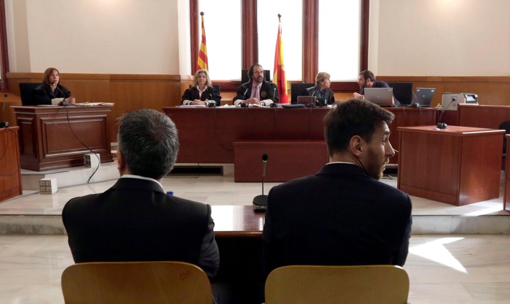 Argentine soccer star Lionel Messi and his father, Jorge Horacio Messi, attend their trial in Barcelona. Photo: ALBERTO ESTEVEZ, EPA.