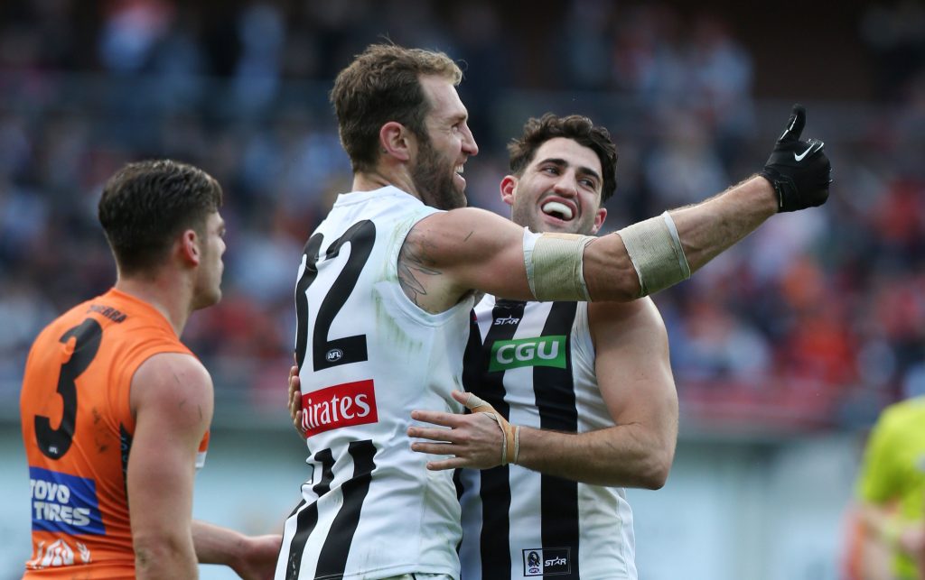 Travis Cloke salutes with his gloved hand after another goal against GWS. Photo: Craig Golding, AAP.
