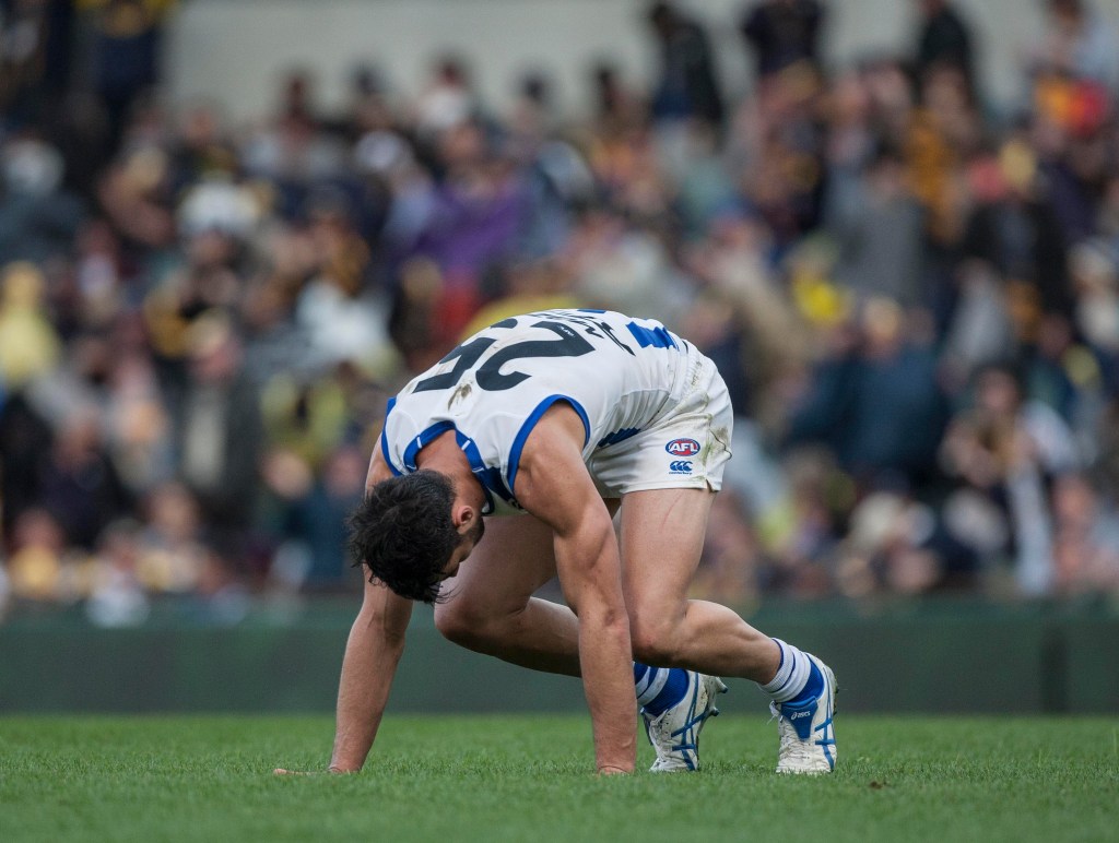 How the mighty have fallen: Robbie Tarrant after the final siren yesterday. After winning their first nine games, North Melbourne are suddenly on their knees. Photo: Tony McDonough, AAP.