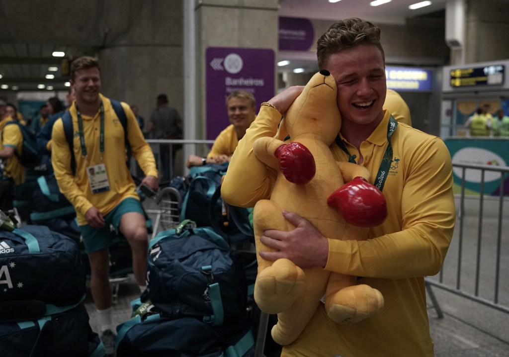 Rugby player Henry Hutchison arrives at the Tom Jobim international airport overnight as the Australian athletes move into the Olympic Village. Photo: Leo Correa, AP.