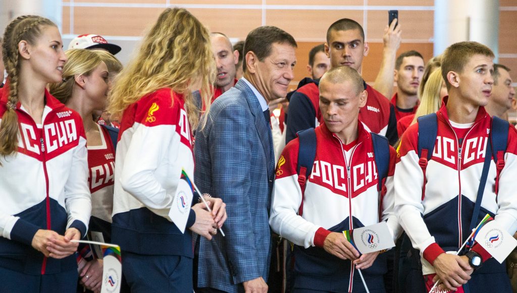 Russian Olympic Committee President Alexander Zhukov with Olympic team members set to depart for Rio. More than 100 Russians from the 387-strong Olympic team have been banned from the games. Photo: Pavel Golovkin, AP.
