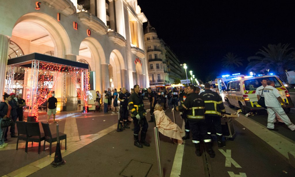 Wounded people are evacuated from the scene  in Nice. Photo: EPA