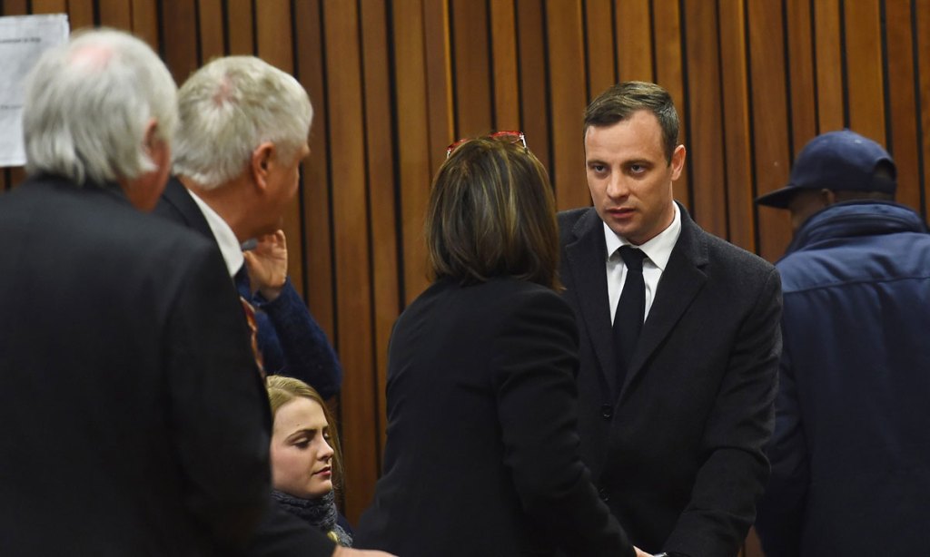 Oscar Pistorius with family members at his sentencing proceeding. Photo: EPA