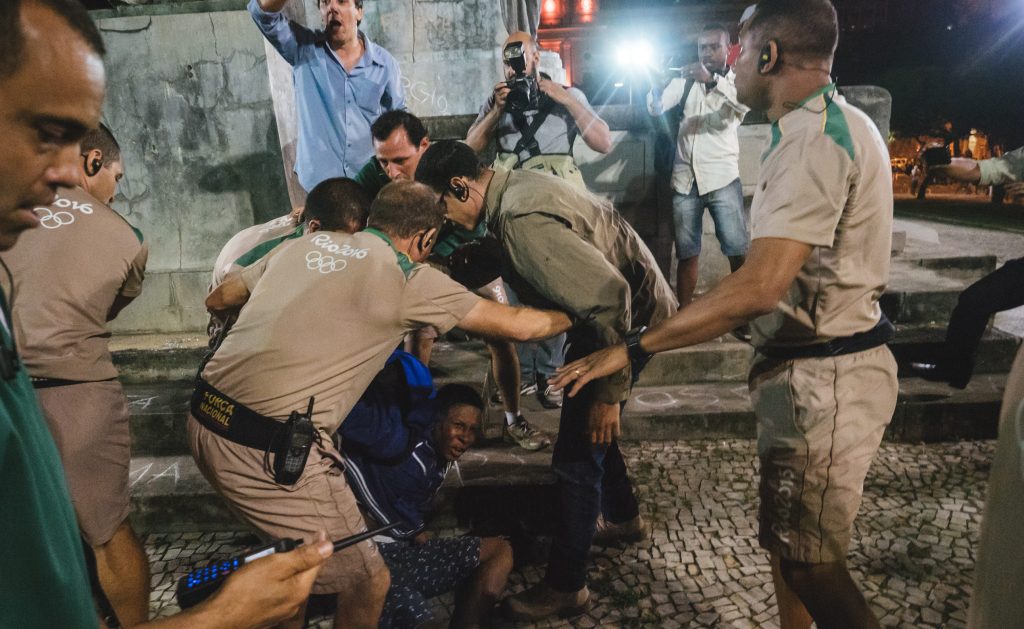Protesters clash with Brazil's police officers during a demonstration against the Olympic torch relay. Photo: Jose Villalba / NewZulu / AAP.