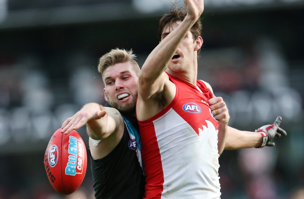 Jackson Trengove takes on Sam Naismith during Port's loss to the Swans. Photo: David Moir, AAP.