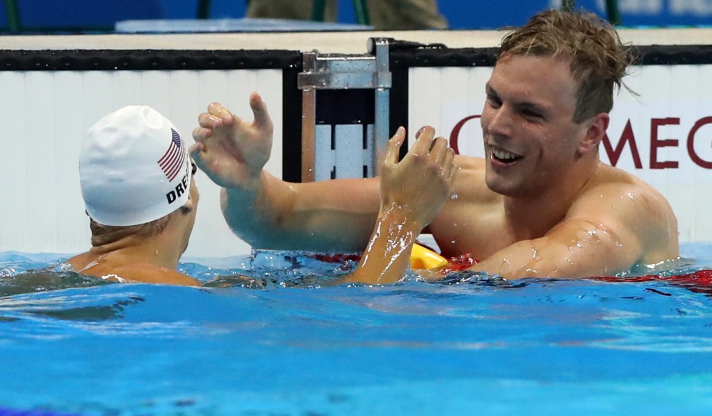 SA's Kyle Chalmers celebrates winning a heat of the men's 100-metre freestyle ahead of second placed Caeleb Dressel from the US. Photo: Lee Jin-man, AP.