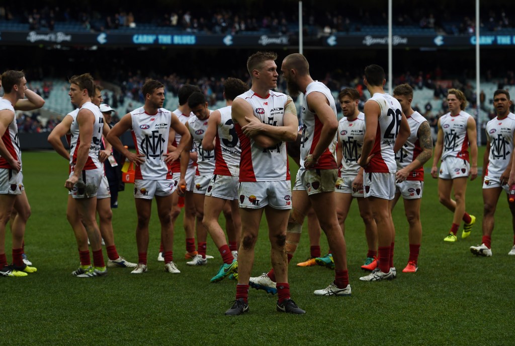 The Demons react after losing their round 22 match against Carlton. Photo: Tracey Nearmy / AAP