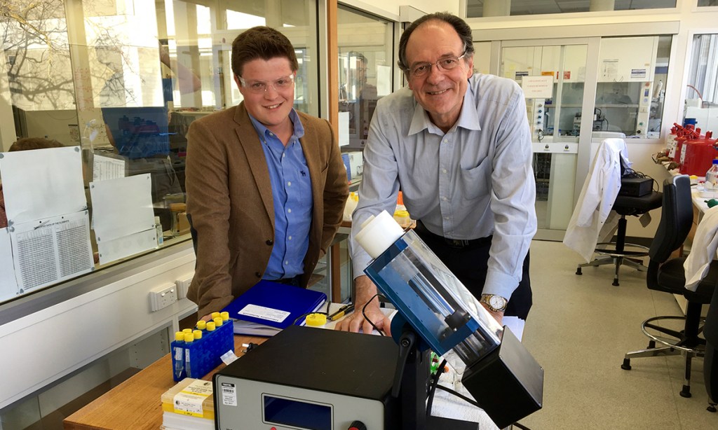 Professor Colin Raston and PhD researcher Joshua Britton with a Vortex Fluidic Device at Flinders University.