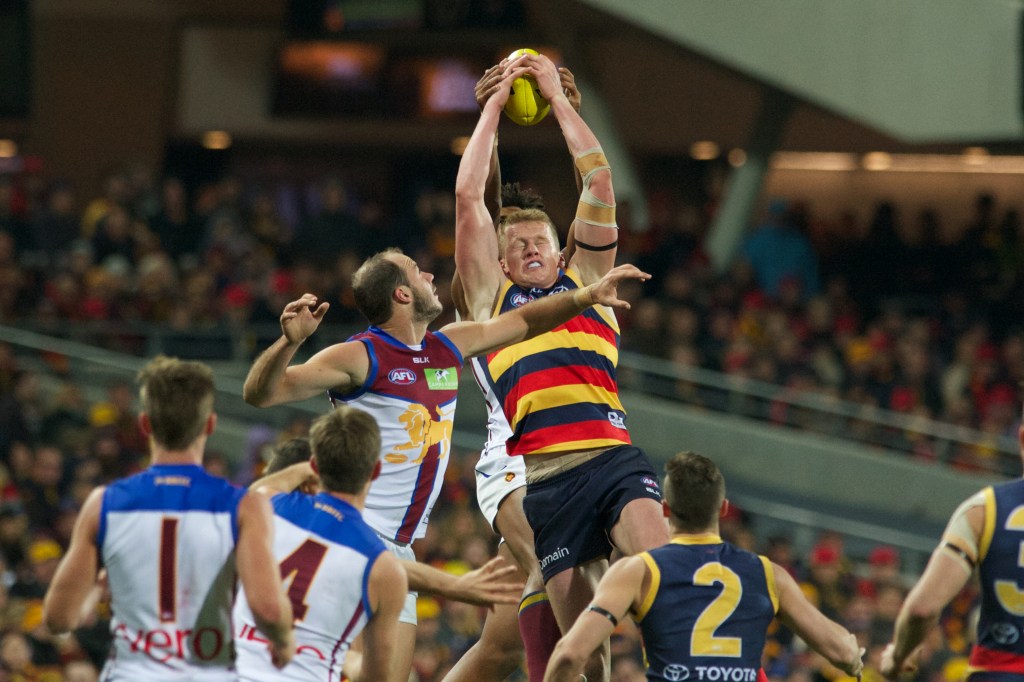 Reilly O'Brien marks strongly before kicking his first AFL goal on Saturday. Photo: Michael Errey, InDaily.