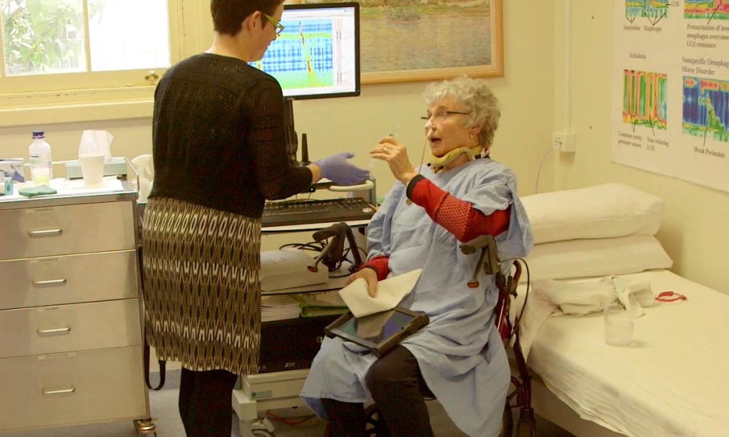 Research nurse Alison Thompson using the AIMplot software with a patient.