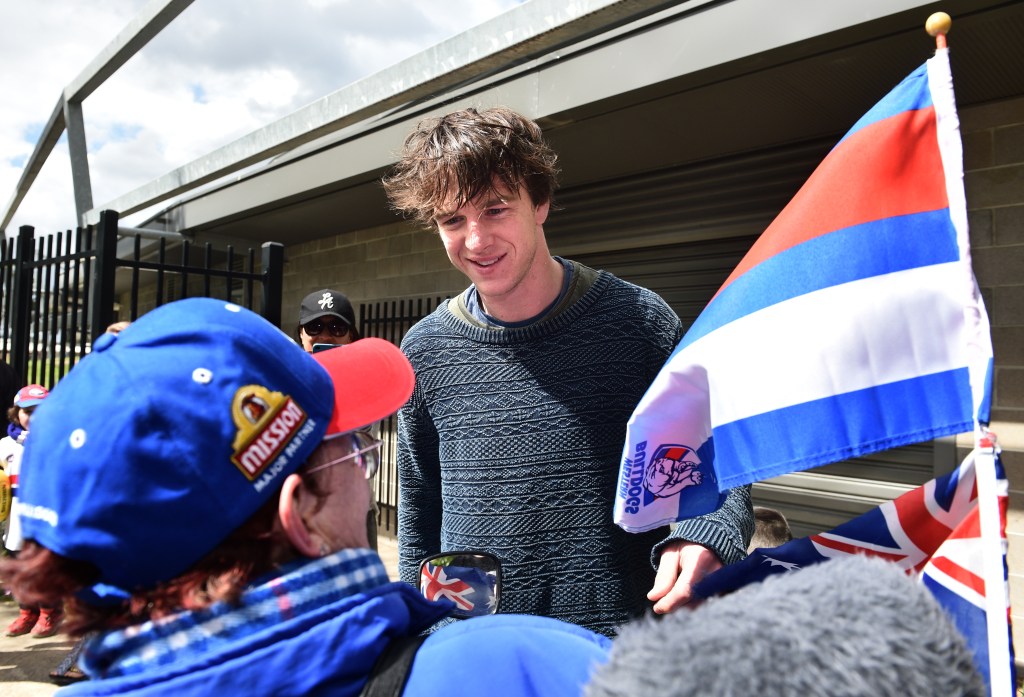 Liam Picken meets Bulldogs fan Sue Silke at Whitten Oval yesterday, after the club made its first Grand Final since 1961. Photo: Julian Smith / AAP