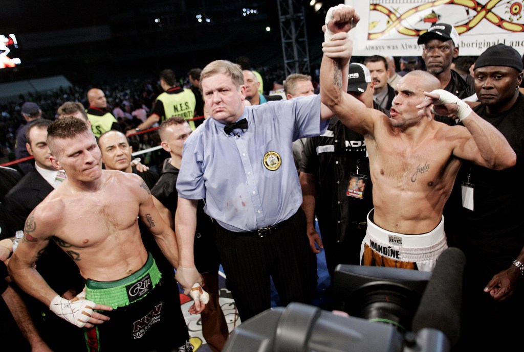 Anthony Mundine, right, is declared the winner in his WBA super-middleweight world title eliminator fight against compatriot Danny Green in 2006. Photo: AP/Mark Baker